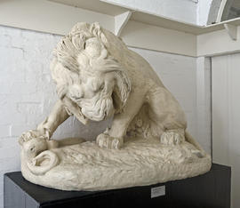 Plaster cast of lion and serpent