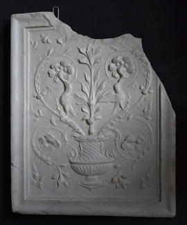 Plaster cast of panel decorated with vase, birds and foliage