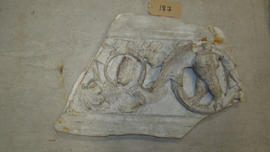 Plaster cast of section of architrave with vines and eagle in clipeus (Version 2)