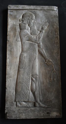 Plaster cast of figure of Ashurnasirpal II in relief holding a poppy (Version 2)