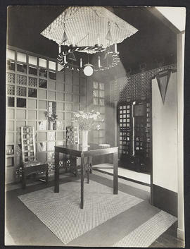 Interior with table, two chars and ceiling light