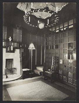 Interior with fireplace, chair and lampshade