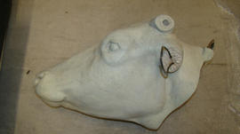 Plaster cast of cow’s head with one anatomical half (Version 1)