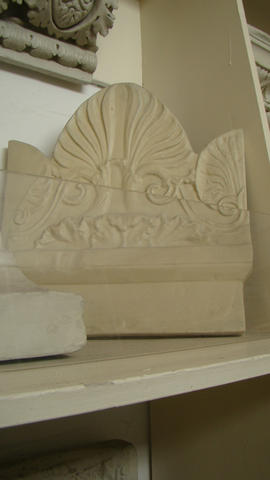 Plaster cast of top part of stele with antefixa ornament and Greek inscription (Version 1)