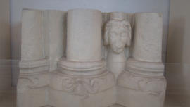 Plaster cast of case of column cluster with human mask (Version 1)