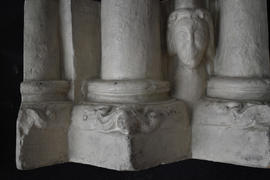 Plaster cast of case of column cluster with human mask (Version 4)