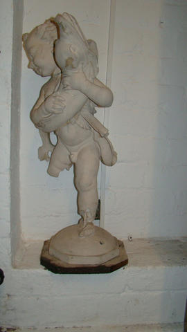 Plaster cast of cherub with dolphin