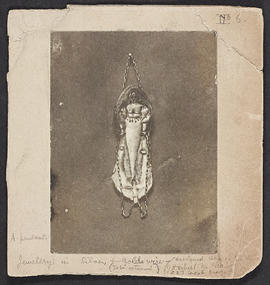 Silver pendant depicting woman