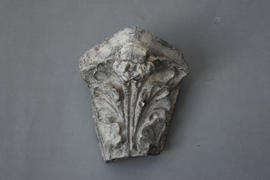 Plaster cast of base of column cluster with human mask (Version 2)