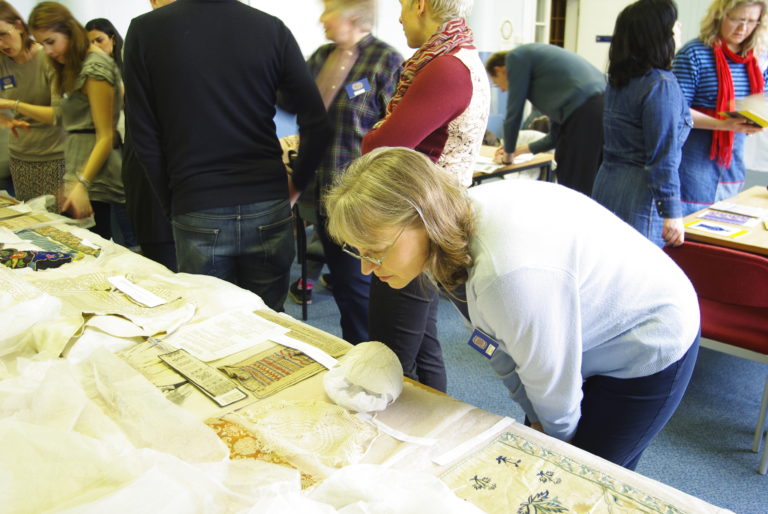 Frances Lennard, senior lecturer in Textile Conservation at the University of Glasgow, inspecting an item from ECA's NDS collection