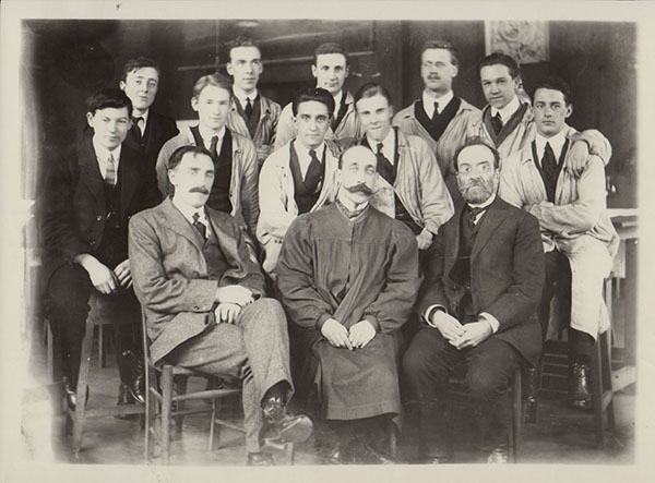 GSAA/P/1/782 Group photograph featuring Charles Gourlay, Eugene Bourdon, Alexander McGibbon (front L-R) and students, c1910