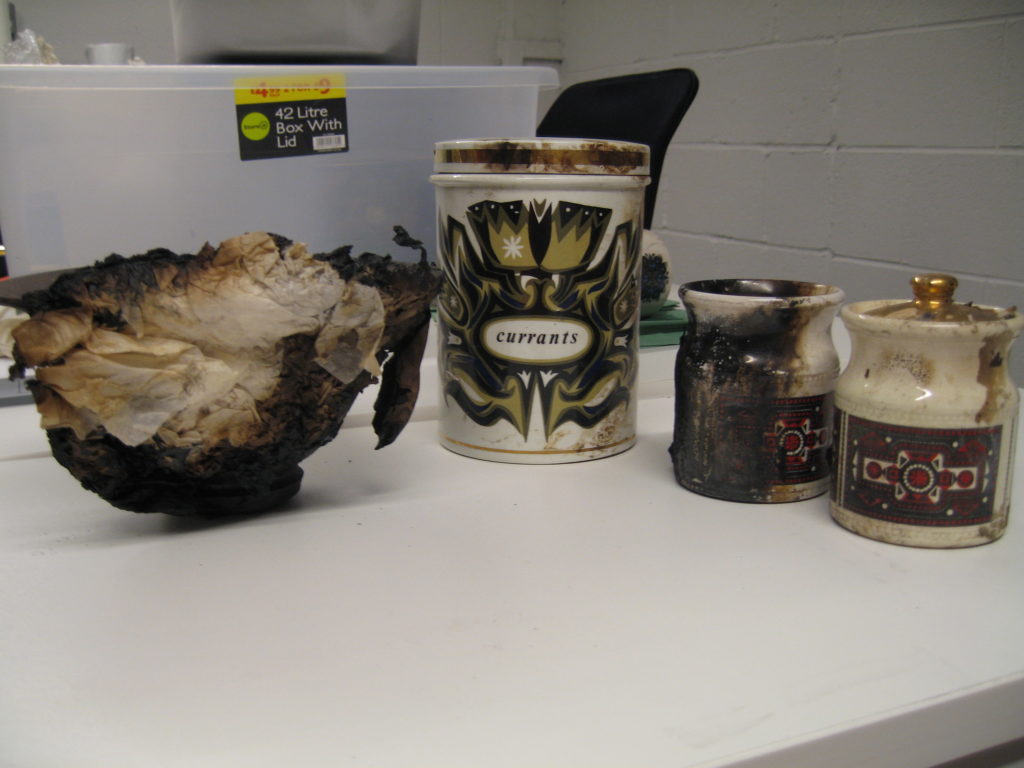 Fig.1 Selection of ceramics that were recovered from the fire. From left to right: Alexander Leckie pot, Robert Stewart kitchen storage jar; Robert Stewart spice jars